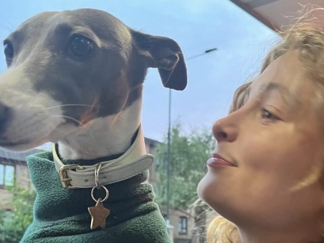 Olive Simms, veterinary care assistant, with a dog